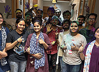Team Enjoying Holi with Colors and Smiles