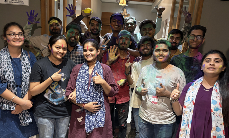 Team Enjoying Holi with Colors and Smiles